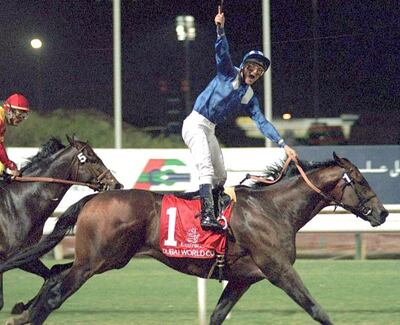 Jockey Richard Hills rides Almutawakel to victory in the Dubai World Cup in 1999. AFP