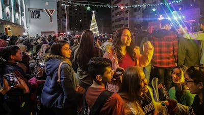 Palestinian youth enjoying themselves at the festive ceremony. EPA