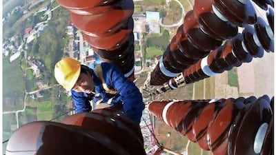 Work on an electricity pylon is carried out in Anqing, China. With about 350 million people anticipated to move into its cities in the next decade, China will face new challenges ranging from availability of social services to adequate energy supply. China Daily / Reuters