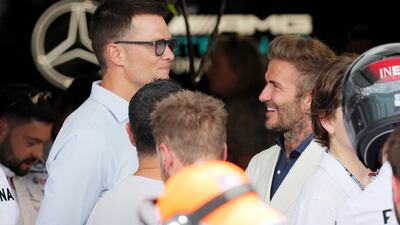 NFL star Tom Brady and David Beckham in conversation before the Miami Grand Prix. Reuters