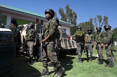 Indian paramilitary troops stand guard inside a government-run school on the outskirts of Srinagar last week, after suspected anti-India militants shot dead two schoolteachers in Indian-administered Kashmir, police said. AFP