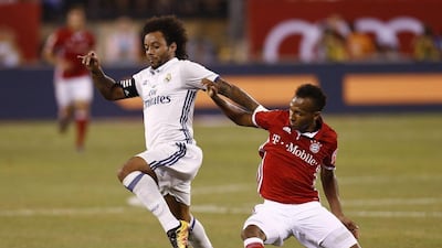 Marcelo of Real Madrid fights for the ball with Julian Green of Bayern Munich during their International Champions Cup match at MetLife Stadium on August 3, 2016 in East Rutherford, New Jersey. Jeff Zelevansky / Getty Images / AFP
