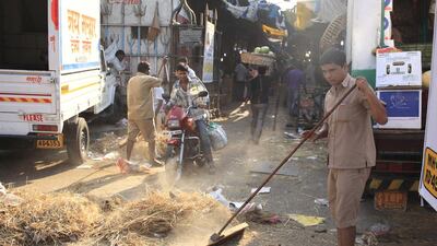 Each morning Mumbai municipal workers do a clean up of Crawford Market. Subhash Sharma for The National