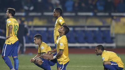 Brazl players come to terms with their Copa America defeat to Paraguay in a quarter-final shootout. Silvia Izquierdo / AP Photo / June 27, 2015