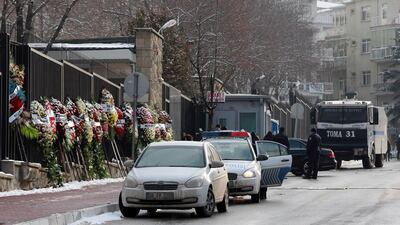 Wreaths are left on the the road leading to the Russian embassy in Ankara on December 21, 2016, two days after Moscow's ambassador to Turkey was gunned down by a Turkish policeman. Adem Altan/AFP