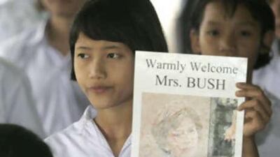 A Karen schoolgirl holds a welcoming poster for US first lady Laura Bush prior to her arrival at Mae Tao clinic near the Thai-Myanmar border.