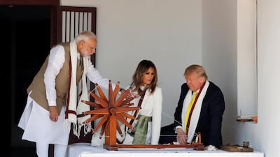 US President Donald Trump and first lady Melania Trump look at Charkha, a type of Indian spinning wheel, next to Indian Prime Minister Narendra Modi, as they visit the Gandhi Ashram in Ahmedabad, India. Reuters