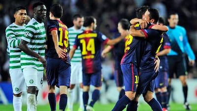 Barcelona celebrate scoring their fourth goal of the night against AC Milan at Camp Nou.