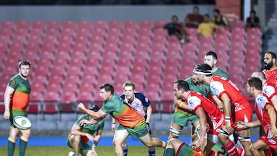 Dubai Knights Eagles take on Dubai Tigers, in red, in the West Asia Premiership at Dubai Sports City on Friday. The Tigers won 27-16.