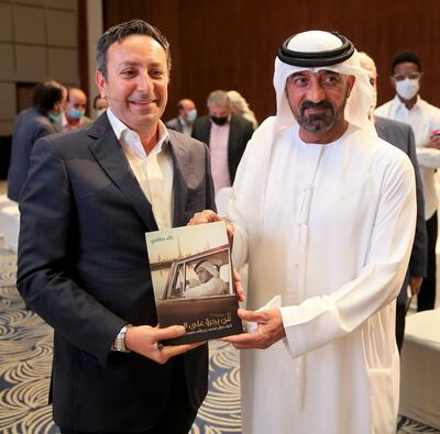 Raed Barqawi, left, with Sheikh Ahmed bin Saeed Al Maktoum, chairman and chief executive of Emirates Airline and Group, during the 'Dare to Dream' book launch. Photo: Emirates Airline Festival of Literature