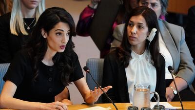 Nadia Murad listens as Amal Clooney speaks at the United Nations Security Council during a meeting about sexual violence in conflict. Carlo Allegri / Reuters
