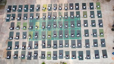 This aerial picture shows members of the Bangladesh police force attending a yoga session to boost the immune system of police personnel during the COVID-19 coronavirus pandemic in Dhaka. AFP