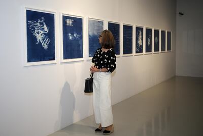 A visitor at Maraya Art Centre, where Shaikha Al Mazrou's works are on view. Courtesy Maraya Art Centre