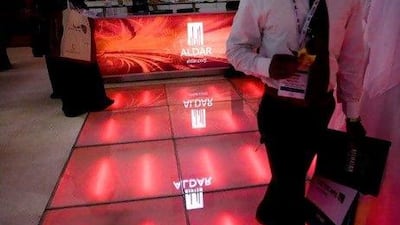 United Arab Emirates - Abu Dhabi - April 22 - 2009 : People walks in the Aldar showroom during Cityscape Abu Dhabi in Abu Dhabi National Exhibition Centre. ( Jaime Puebla / The National ) *** Local Caption *** JP45 CITYSCAPE AD.jpg
