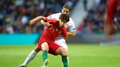 Switzerland's Ricardo Rodriguez (back) in action against Portugal's Joao Felix (front) during the UEFA Nations League semi final. EPA