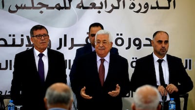 Palestinian Authority President Mahmud Abbas (C) recites the Fatiha, or the prayer of the dead, during a meeting with the Revolutionary Council of the ruling Fatah party. AFP