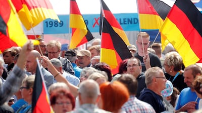 Supporters attend an Alternative for Germany (AfD) rally. The far right party claimed Syria was safe for refugees to return after sending a delegation there in November 2019. Reuters