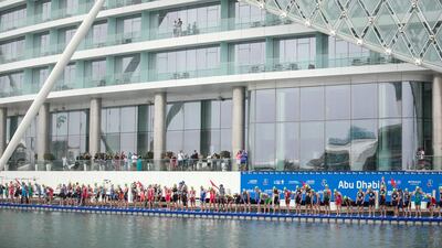 Triathletes get ready to begin the ITU World Triathlon Abu Dhabi. Reem Mohammed / The National
