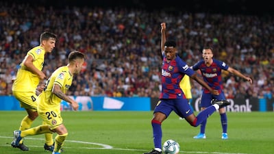 Barcelona's Ansu Fati in action with Villarreal's Ruben Pena. Reuters