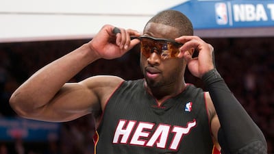 Dwyane Wade (basketball). The former Miami Heat guard suffered with severe migraines, and so started wearing glasses with an orange tint to protect his eyes from the bright lights on the basketball court. Reuters