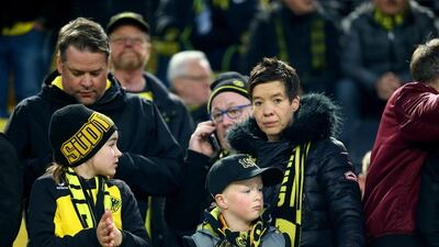 Fans of Dortmund in the stands await a match that was later postponed. Christof Koepsel / Getty Images