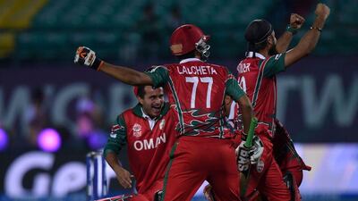 Oman players celebrate after their World T20 victory over Ireland in the final over on Wednesday in Dharamsala. AFP Photo / March 9, 2016