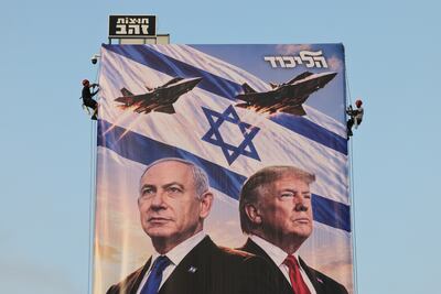 A Likud Party election billboard with Israeli Prime Minister Benjamin Netanyahu, left, US President Donald Trump and fighter jets, in Tel Aviv, Israel, on October 25. EPA