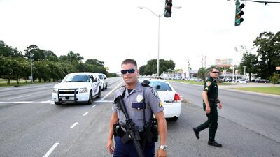 Policemen block a road after fellow officers were shot in Baton Rouge, Louisiana, on July 17, 2016. Joe Penney / Reuters