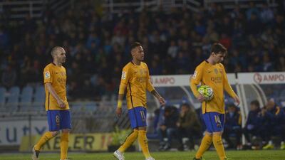 Barcelona’s Andres Iniesta, Neymar and Lionel Messi react during their loss on Saturday to Real Sociedad in La Liga. Vincent West / Reuters / April 9, 2016