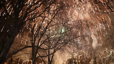People watch fireworks explode during New Year's celebrations in Belgrade, Serbia. EPA