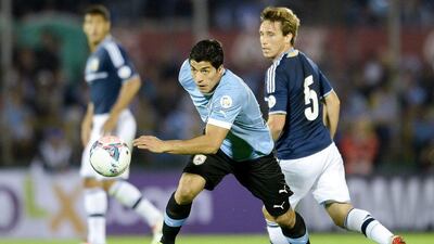 Luis Suarez, left, during Uruguay's 3-2 win over Argentina on Tuesday night. Buda Mendes / Getty Images