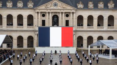 French President Emmanuel Macron (C) stands in front of Republican Guards carrying victims' portraits during a ceremony to pay tribute to the 42 French citizens killed and to all the victims of the 07 October Hamas's attack on Israel, four months after the attacks, in the courtyard of the Hotel des Invalides in Paris, France, 07 February 2024. Thousands of Israelis and Palestinians have been killed since the militant group Hamas launched an unprecedented attack on Israel from the Gaza Strip on 07 October 2023, and the Israeli strikes on the Palestinian enclave which followed it. EPA / CHRISTOPHE PETIT TESSON
