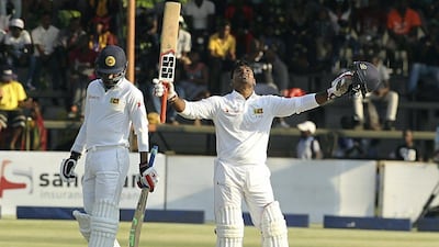 Sri Lankan batsman Kusal Perera celebrates after scoring 100 runs against Zimbabwe on Day 1 on Saturday. Tsvangiray Mukwazhi / AP Photo / October 29, 2016