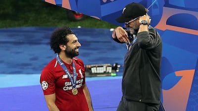 Klopp and Salah enjoy that winning moment. EPA