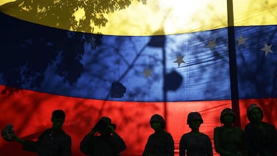Students from the Experimental University of the Arts make a performance to protest against the military repression on the civil society and students during protests against Venezuelan President Nicolas Maduro, in Caracas. Juan Barreto / AFP