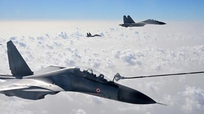 Indian fighter jets take part in an air refuelling exercise during a joint military exercise with France in Rajasthan. AFP