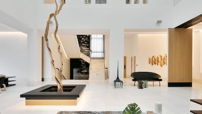 The grand staircase connected to the central hub of the home.