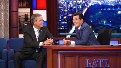 Stephen Colbert, right, talks with Republican presidential candidate Jeb Bush in 2015 debut show. Jeffrey R. Staab / CBS via AP