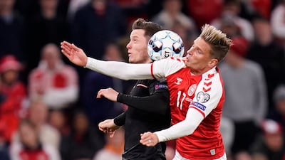 Denmark's Jens Stryger Larsen, right, and Austria's Michael Gregoritsch battle for the ball. AP