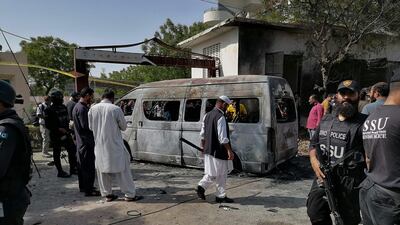 Police inspect the site of a deadly blast near the China Institute at the Karachi University in Pakistan. AFP
