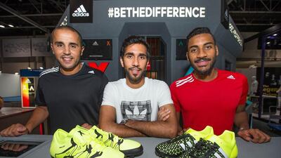 Al Ahli midfielder Habib Fardan, centre, alongside Fujairah and Algeria defender Madjid Bougherra, left, and Al Jaizra's Khamis Esmail at the Adidas Football Bunker launch. Courtesy: Adidas