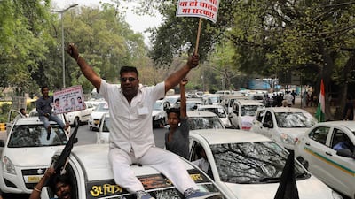 Indian drivers of app-based taxi services shout slogans during a protest against Ola and Uber companies in New Delhi. Uber and Ola drivers in New Delhi went on srike last week to demand better pay and working conditions. Rajat Gupta/ EPA