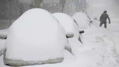 A man shovels snow during a winter storm in Canada. Reuters