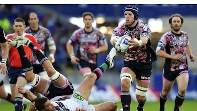 The world tour of Haskell, second from right, saw him collect the ball for Stade Francais during the Amlin Challenge Cup Final match earlier this year.