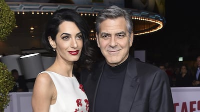 Amal Clooney and George Clooney AP