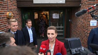 Mette Frederiksen, Prime Minister of Denmark and leader of the Social Democrats, addresses the media after casting her vote in Hareskovhallen. AFP
