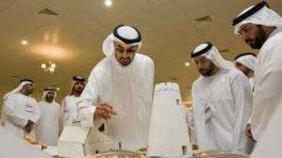 Sheikh Mohammed bin Zayed, Crown Prince of Abu Dhabi and Deputy Supreme Commander of the Armed Forces, inspects a date during last year's festival.