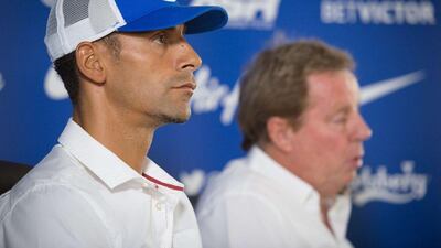 Queens Park Rangers defender Rio Ferdinand shown at a press conference with manager Harry Redknapp on Monday. Leon Neal / AFP / July 28, 2014