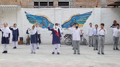 Pupils take part in a sports class.