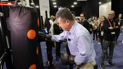 The I-Percut smart cover goes over a traditional punching bag and when connected to the company's mobile app, guides users in their training by measuring strength, reaction time, speed and the number of hits. AFP